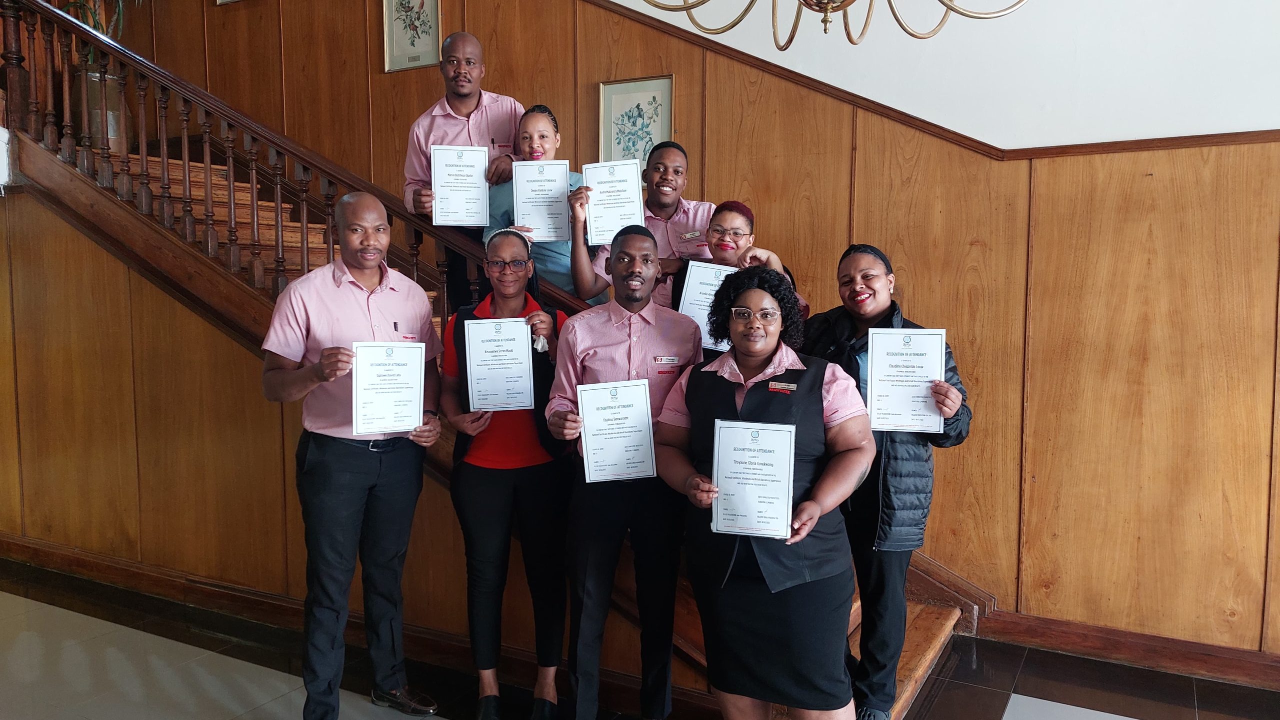 Shoprite and Checkers NQF 4 supervision programme graduates holding certificates